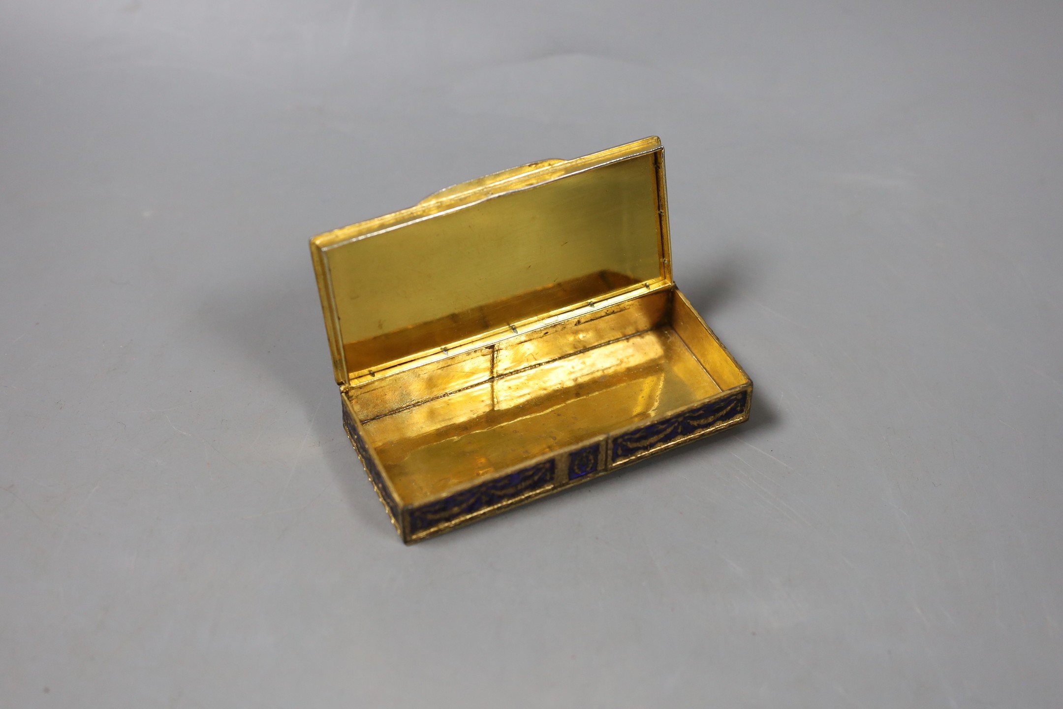 A gilt metal and blue enamel snuff box